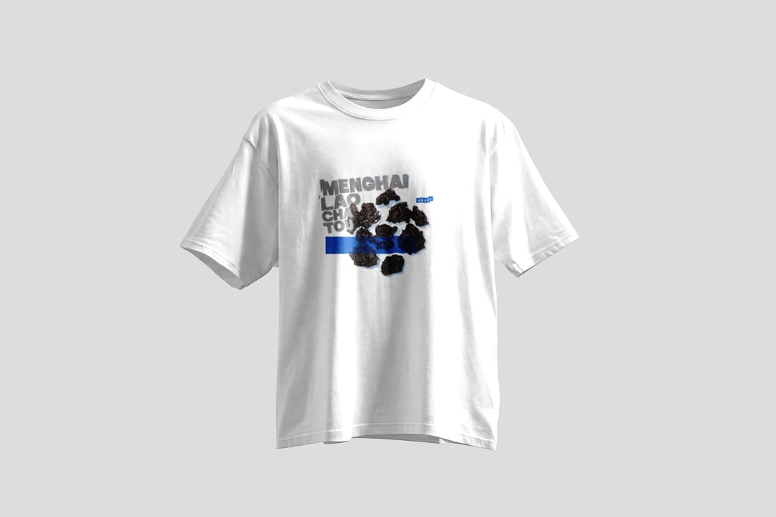 Pressed pu-erh clumps on cream paper, half of them knocked out in flat electric blue inside a rectangle, under a torn blue headline